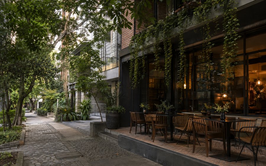 Provenza, El Poblado, Medellín — tree-lined street with cafés and boutiques